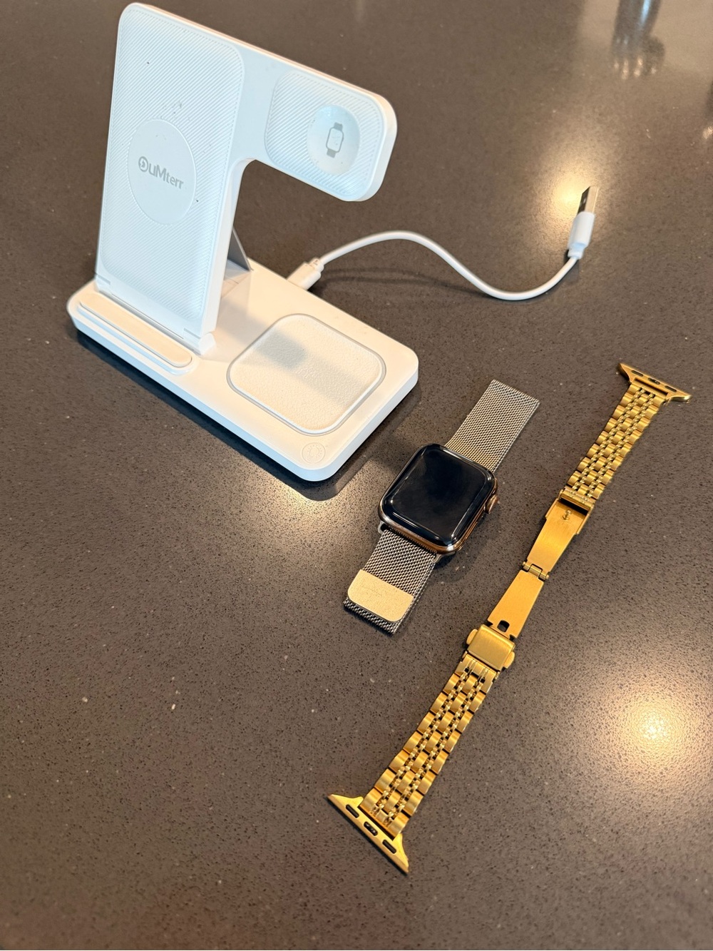 Apple Watch Series 4 Gold Titanium 40MM (Comes with two bands + charger station)